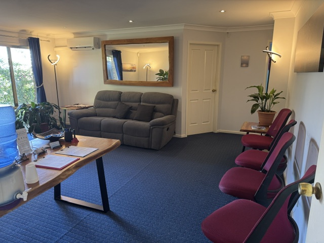 Tea Gardens Osteopath welcoming waiting room with comfortable seating and plants